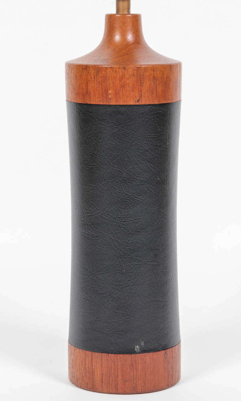 Danish-influenced wood and black leather wrapped table lamp by ESA. USA, circa 1960.