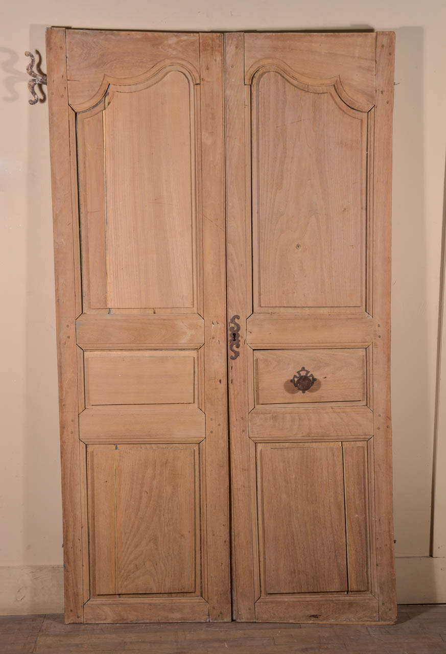 Pair of hand planed, carved and scrubbed oak doors with original iron hardware, from Chateau de Gaston Phebus, in Sauveterre, France.