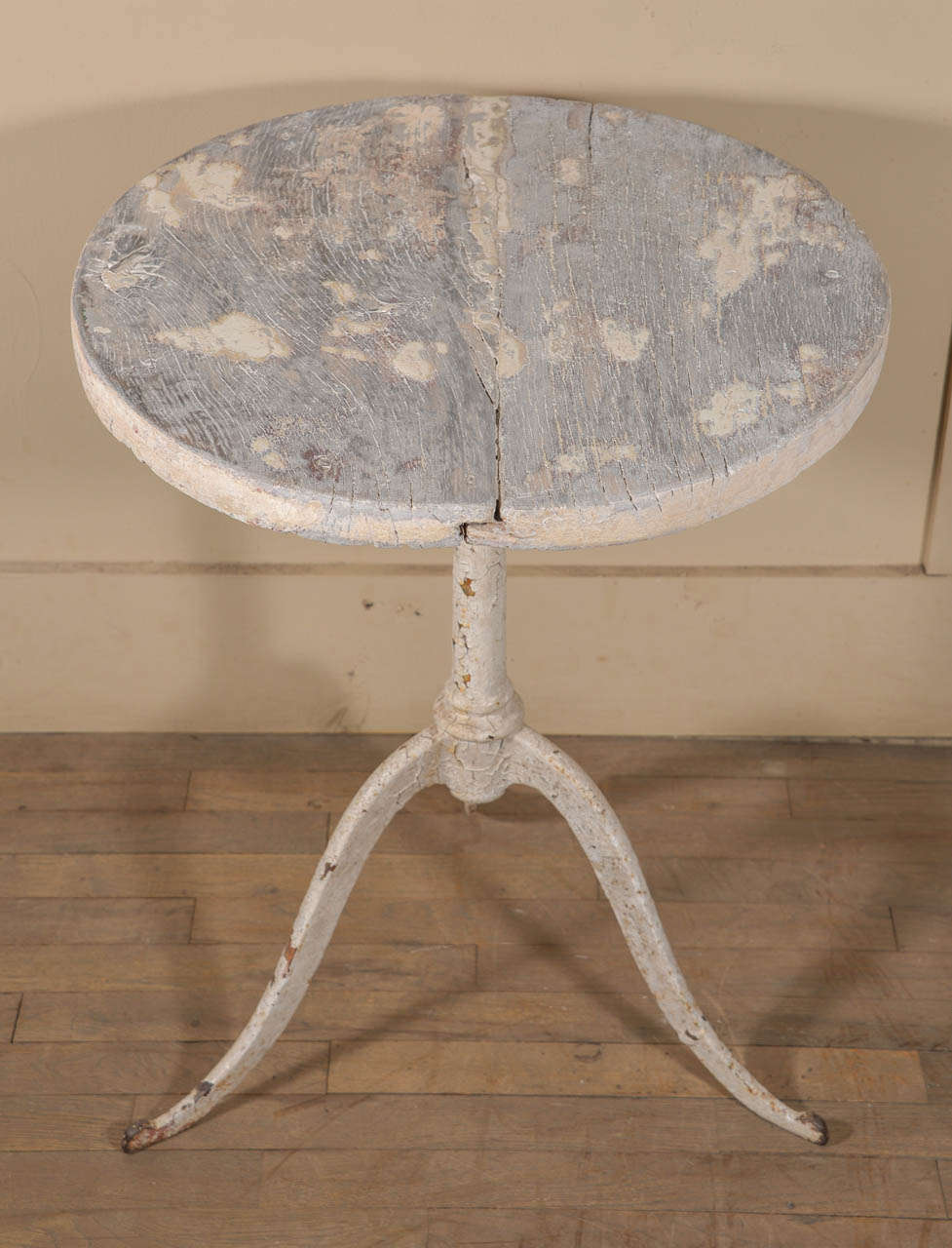 18th century painted French bistro-style table with iron base and wood top.