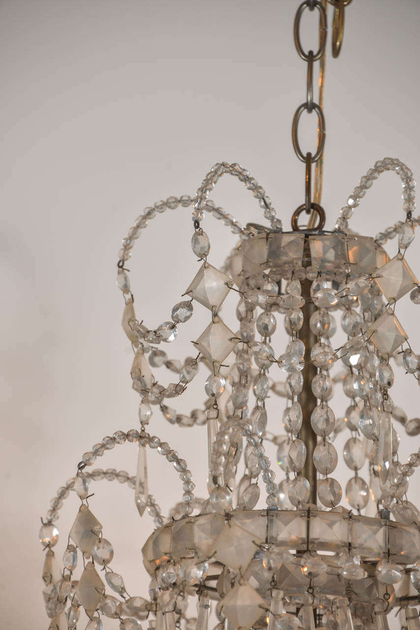 Seven-Light Crystal Three-Tier Chandelier In Fair Condition For Sale In Houston, TX
