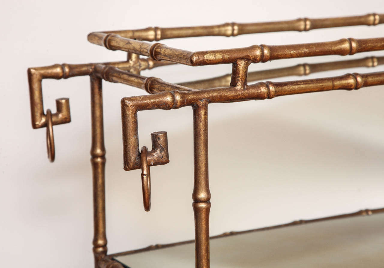 A Pair of Antique Gilt Brass Faux Bamboo Etagere Tables, France, c. 1940 In Excellent Condition In New York, NY