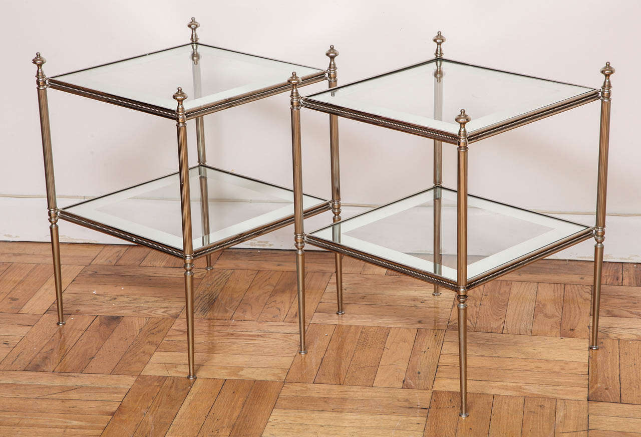 A Pair of Silver Gilt Two Tier Etagere Tables with Mercury Bordered Glass Inserts. France, c. 1950