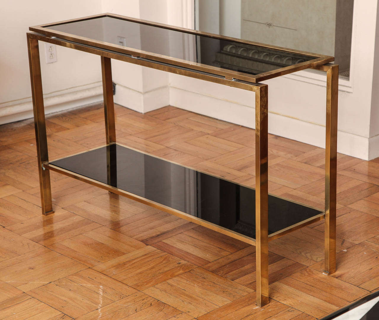 A Two-Tier Brass and Black Glass Console Table, France c. 1970 1