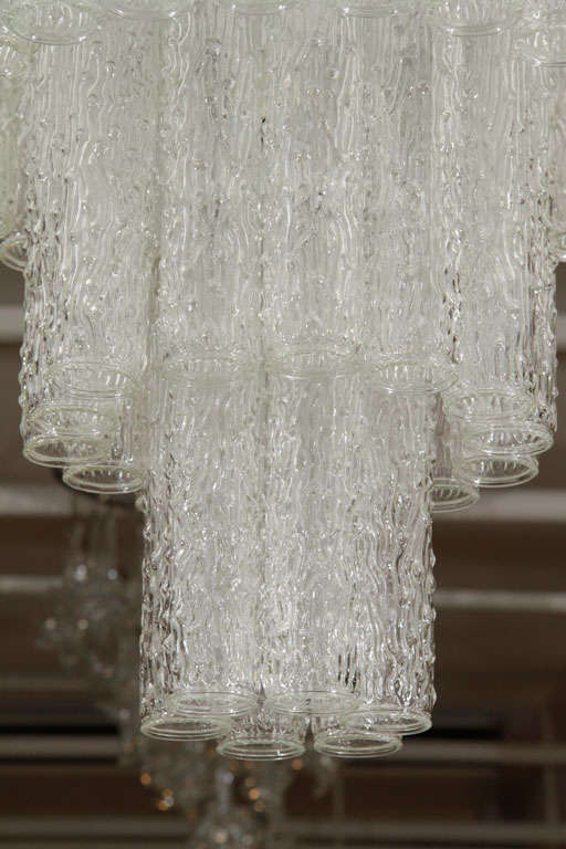 A striking Italian Murano clear, molded- glass waterfall chandelier.