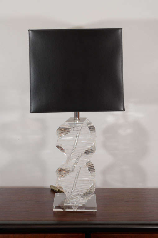 Boldly sculpted Lucite with a twisting stack of Lucite square pieces. Please contact for location. 