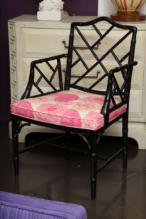 Armchair in ebonized faux bamboo with upholstered seat.
American, c. 1950