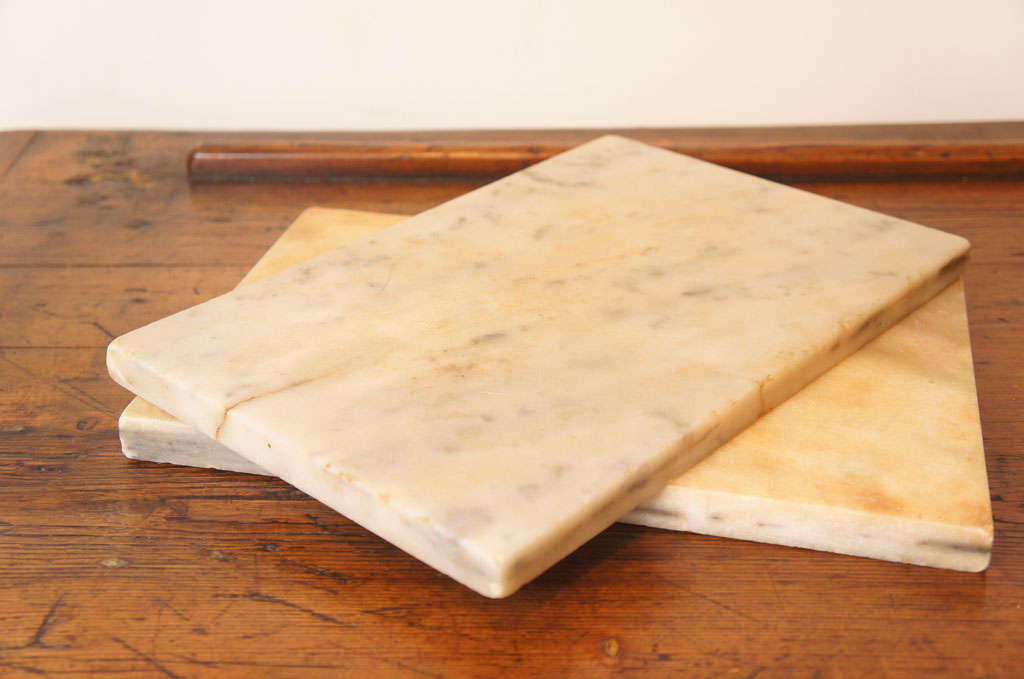 These two pieces of marble, came from and English kitchen where they were either used as a cutting board or large coasters , to hold a bottle of wine. they are $100 EACH or $175 for BOTH. There is wonderful grain in the marble