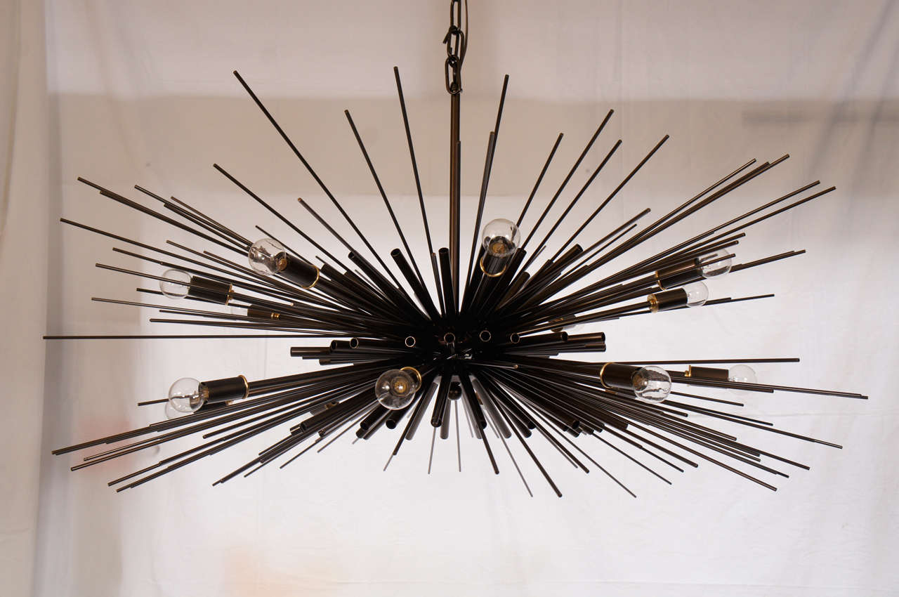 Powder coated bronze chandelier. Sixteen lights. Hand-cut, shaped, by acclaimed artist Lou Blass, then welded by the artist himself.
The entire collection of licensed Lou Blass sculptures and lighting editions are available in the US exclusively
