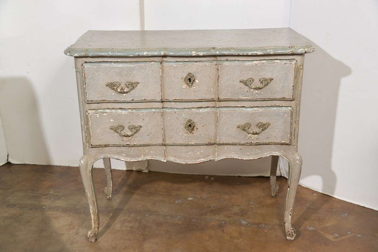 19th c. Petite Commode Sauteuse on cabriole legs.  Paint is more recent.  Two working drawers. Beautiful arbalete-like movement on table top and on drawers.