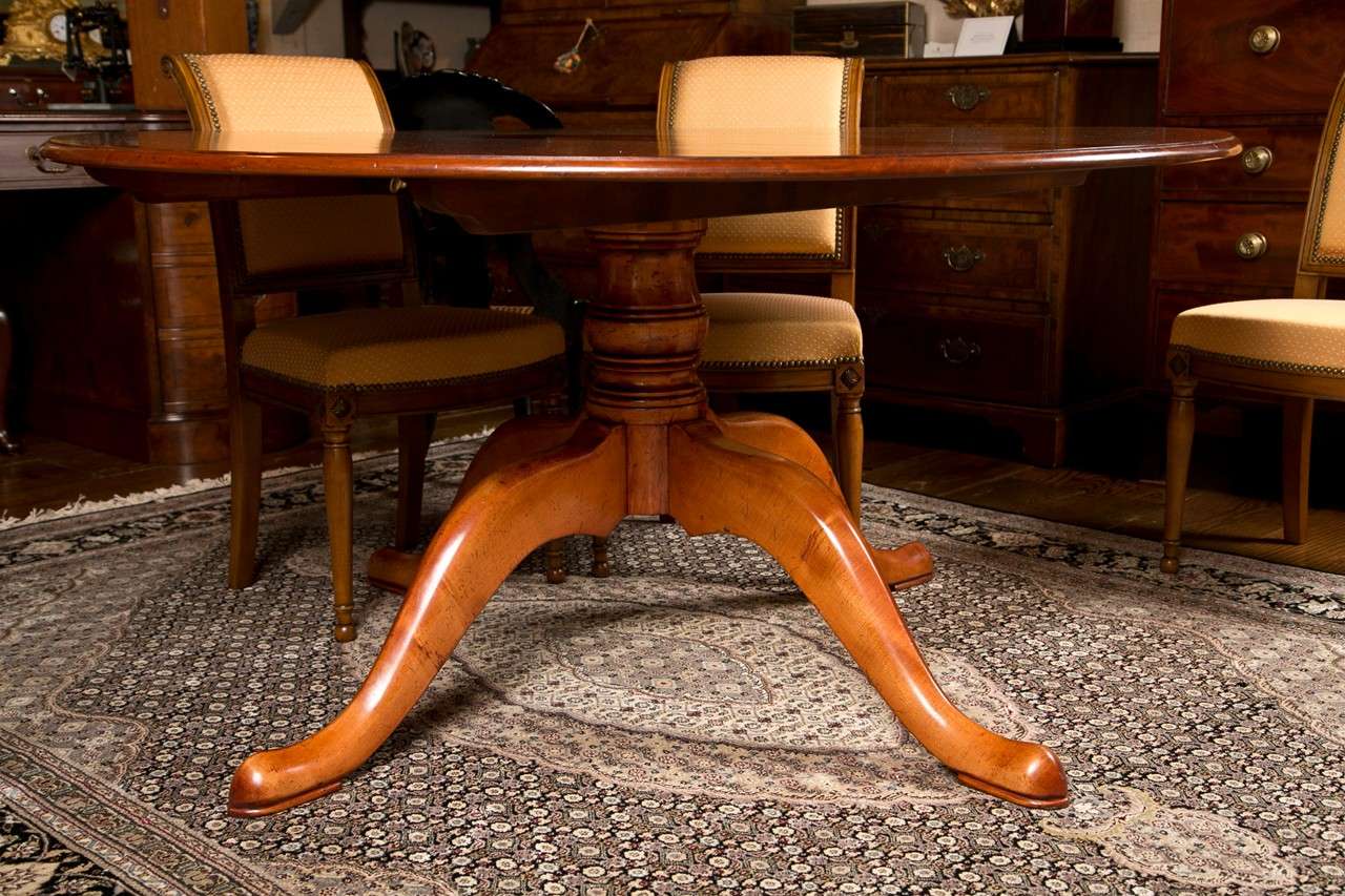 This charming country table made of hand planed cherry in the color of fresh honey offers seating for six--and a squeezed eight is not out of the question. A bold, four leg pedestal anchors this table physically and visually, allowing it to be