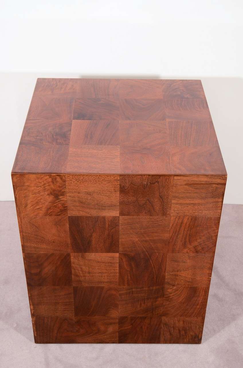 A vintage cube shaped side table with a lacquered patchwork wood veneer. The piece is in good vintage condition with age appropriate wear. Some scratches.

Reduced from: $2,100