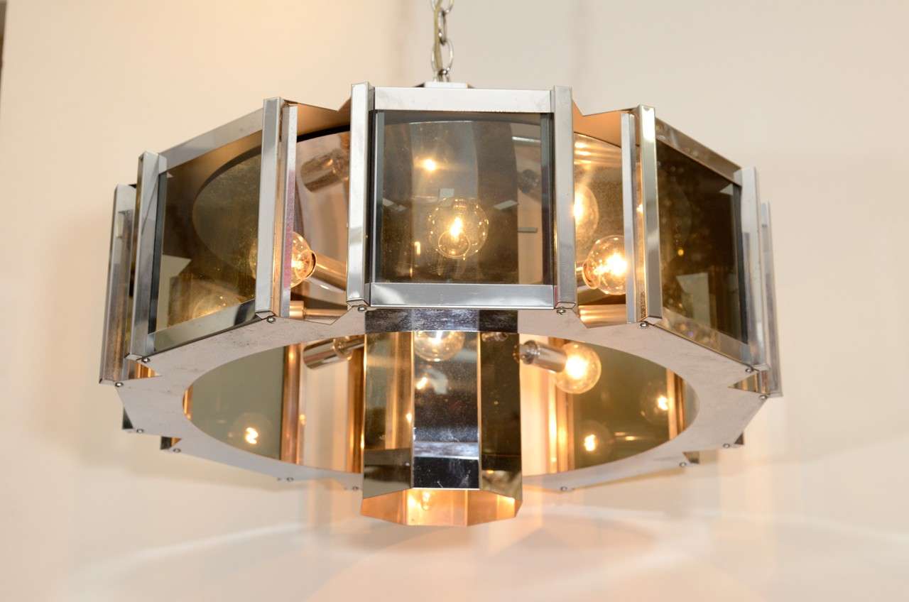 A vintage octagonal chandelier in chrome with smokey glass inserts. The piece is designed by Frederick Raymond

Reduced from $1,450
