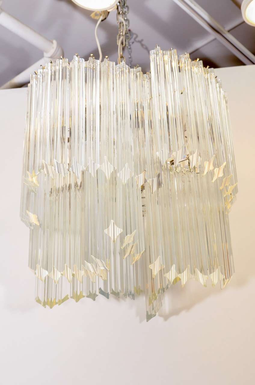A vintage chandelier by Venini in a unique shape composed of clear glass rods suspended from a chrome frame