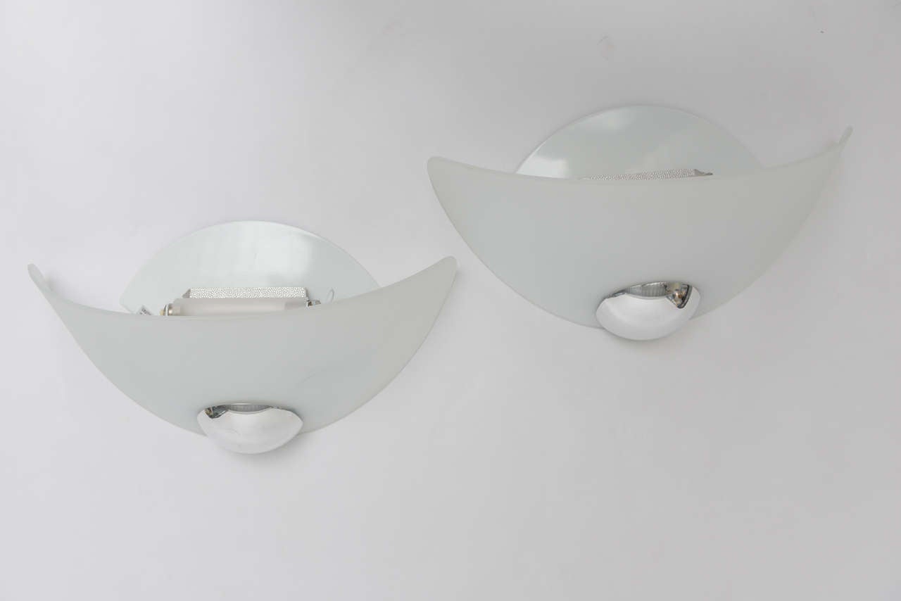 Beautifull sconces by Arteluce for Flos made of white frosted glass and metal chrome plated accent.