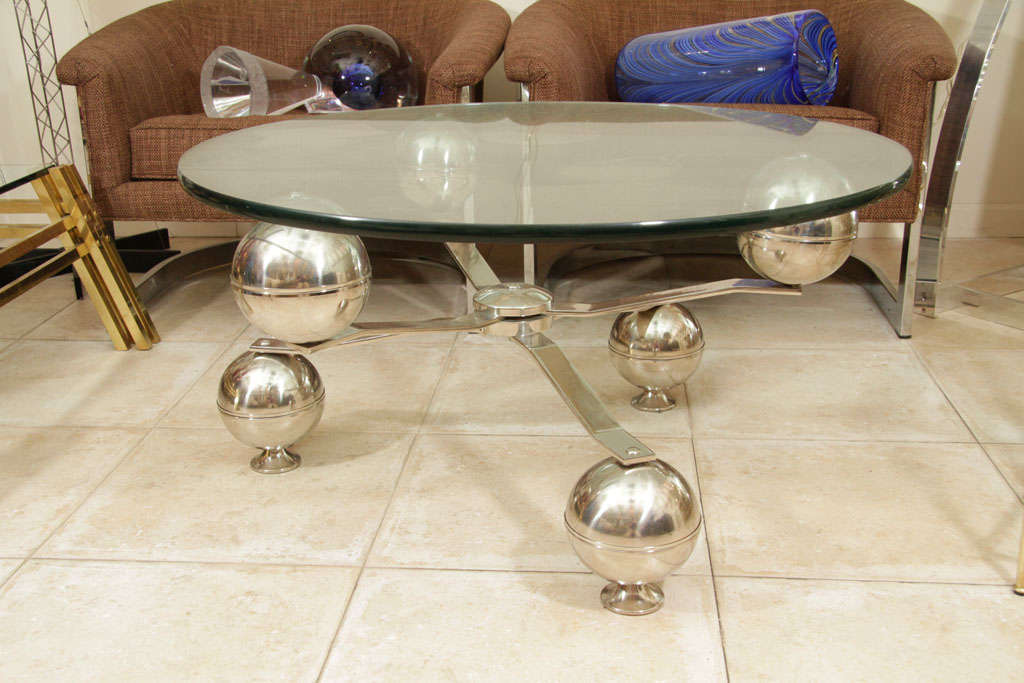 Circular coffee table with industrial base and glass top 2