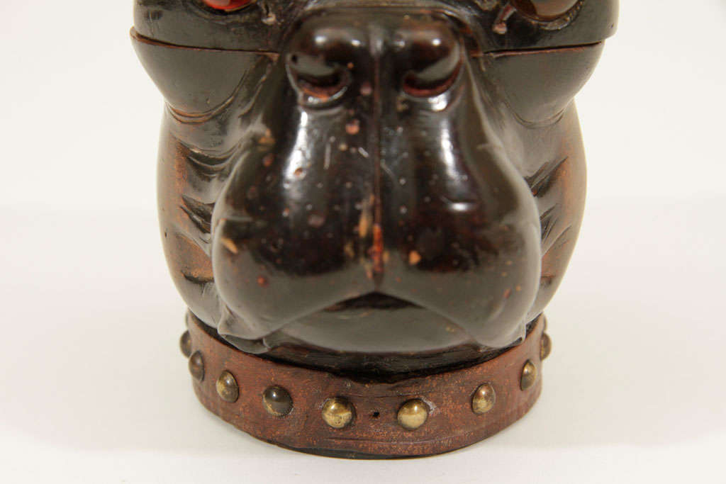 Carved wooden pug motif inkwell with amber eyes and studded leather collar