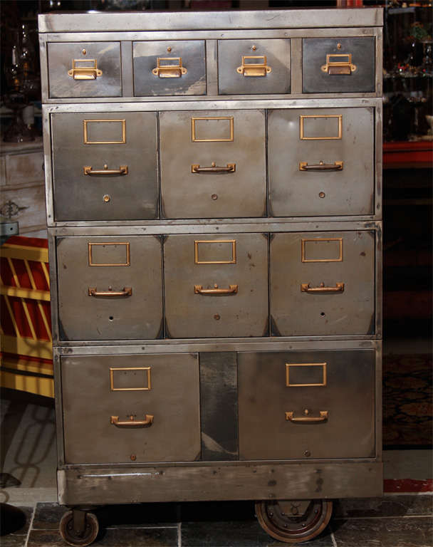 Industrial,  stacking steel cabinet.  Five sections, brass hardware,  on casters.