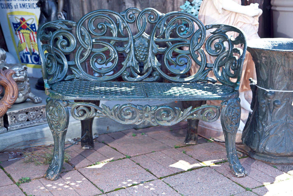 Beautiful Antique Iron Bench. Painted Green Finish. Vine Motif with Grapes in Center and on Legs. Heavy Cast. Classic Style.