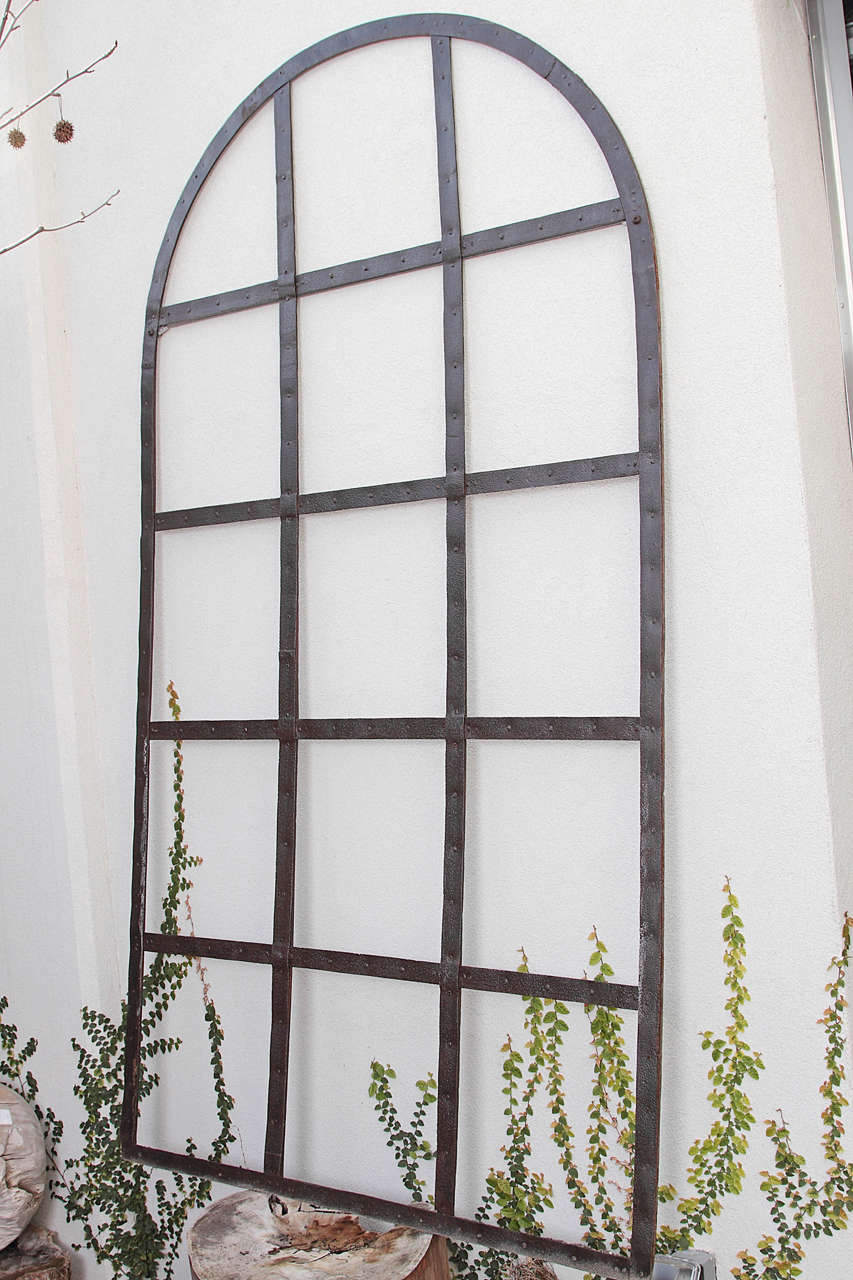Industrial window frame trellis.
Cast iron wall decor
circa 1920.
Origin: London, England
Traditional elegant garden appeal 

Can be used for indoors or outdoors, suitable for all weather.