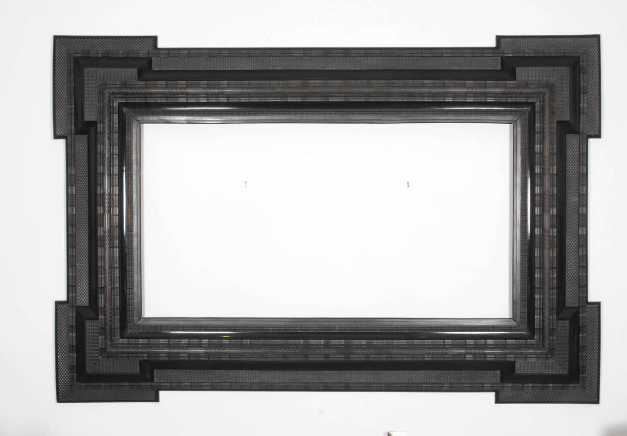 A Dutch Baroque style ebonized frame, Late 19th Century, of classic form with extended corners, ripple and basket weave carved and cast molding. 

This frame was released from the Danish Royal inventory in 2014. Apparently from Frederiksborg,