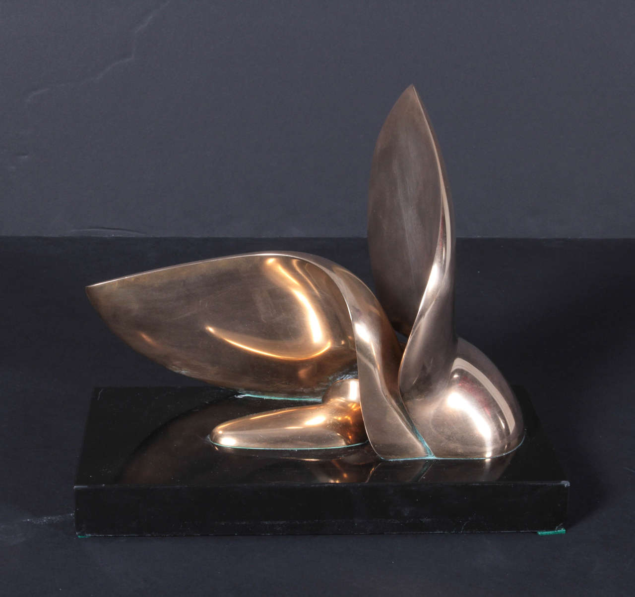 Abstract biomorphic sculpture in polished bronze on a black granite base. By California sculptor Jack Zajac (b 1929), ca 1980