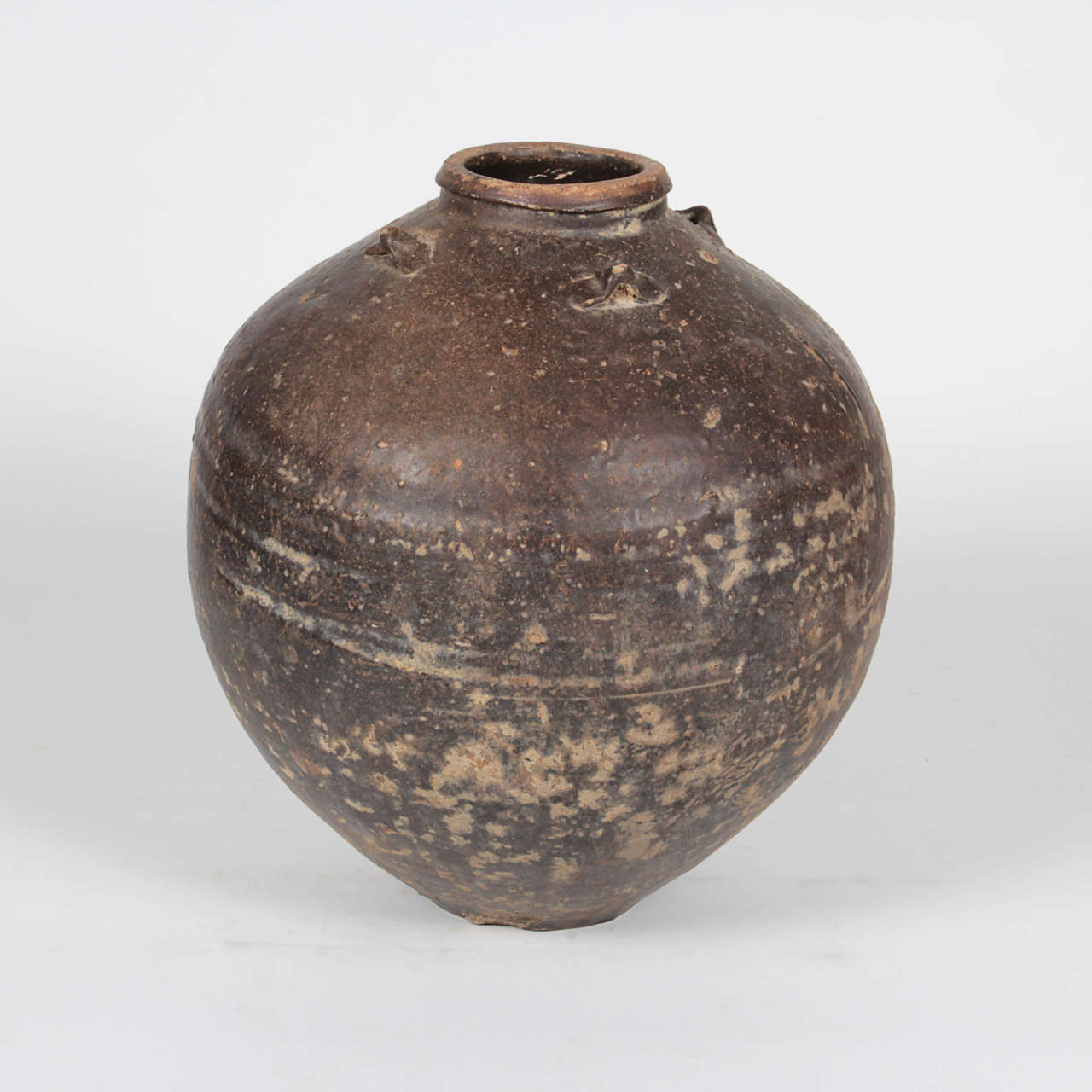 Antique round ceramic pot from Indonesia. Personally selected by Donna Karan for her Urban Zen brand.