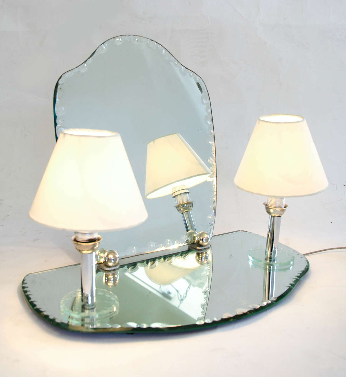 Romantic dressing table mirror with integral 'candle' lights on chrome stems. Mirror and semi-circular tray have 