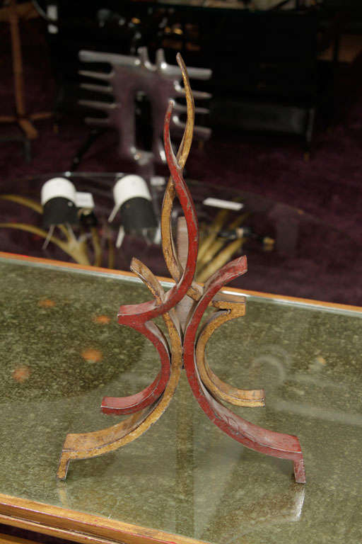 Pair of andirons forming a stylized flame designed by Raymond Subes.
Wrought iron
France
1940's