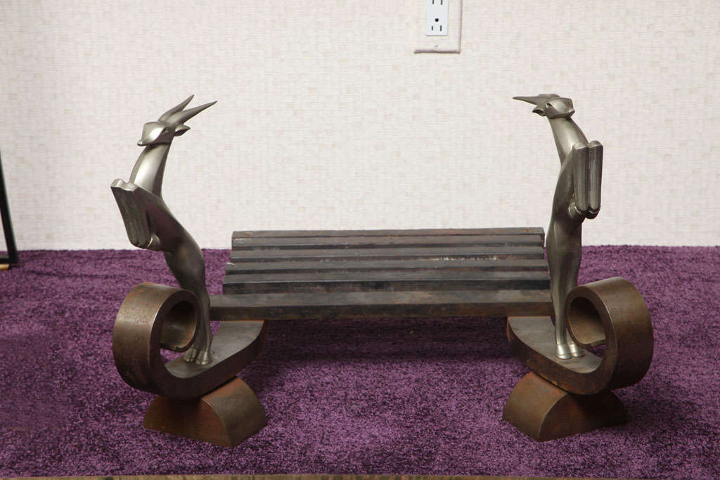 Cast iron and nickeled bronze andiron by Edgar Brandt