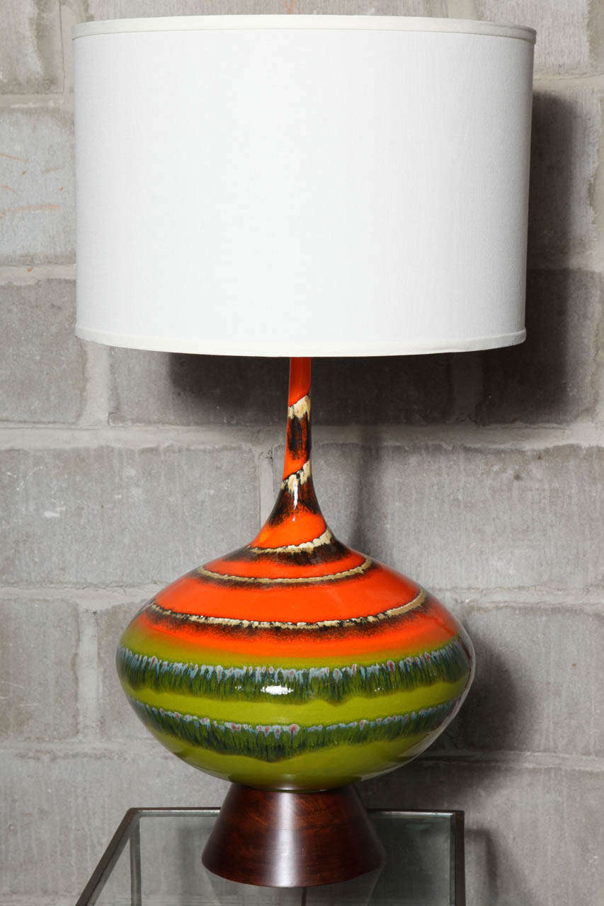 Fun  shape with spectacular colors make these lamps truly special, walnut bases.  REDUCED from 2800 to 1960.  Since ceramic is hand glazed there may be variations.  Overall height is 34