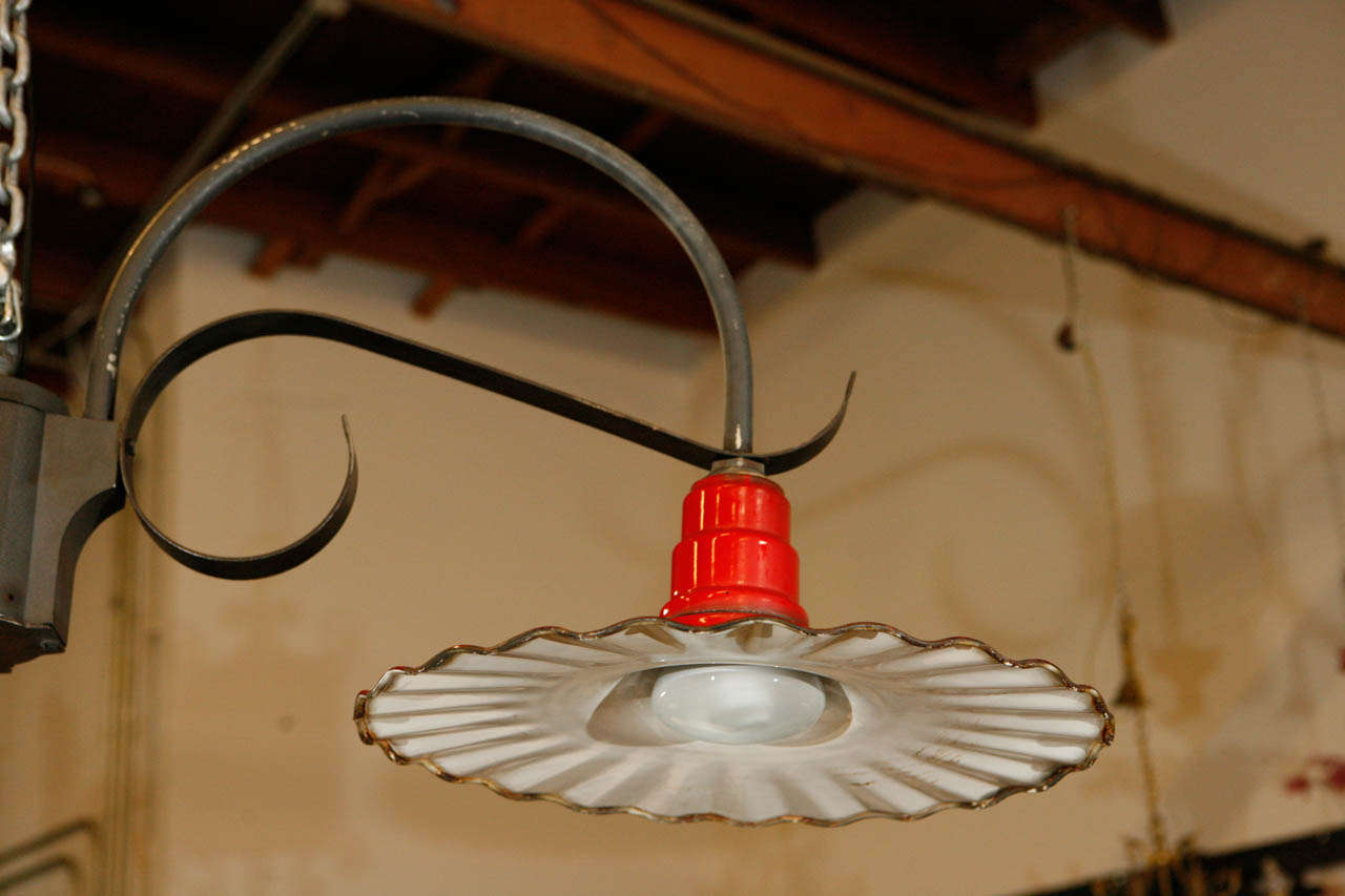 This is a great looking gas station lamp re-fitted to be used as a hanging light. We were so happy to find these iron and enameled aluminum lamps we have made it possible to use them as hanging lights with internal wiring and new sockets for use