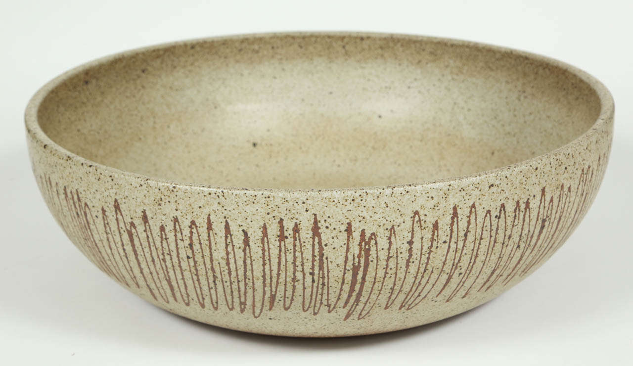 AP 4089 Bowl in light olive glaze with vertical scraffitto.  This the largest of the glazed ceramic bowl planter's, in this form, by David Cressey.