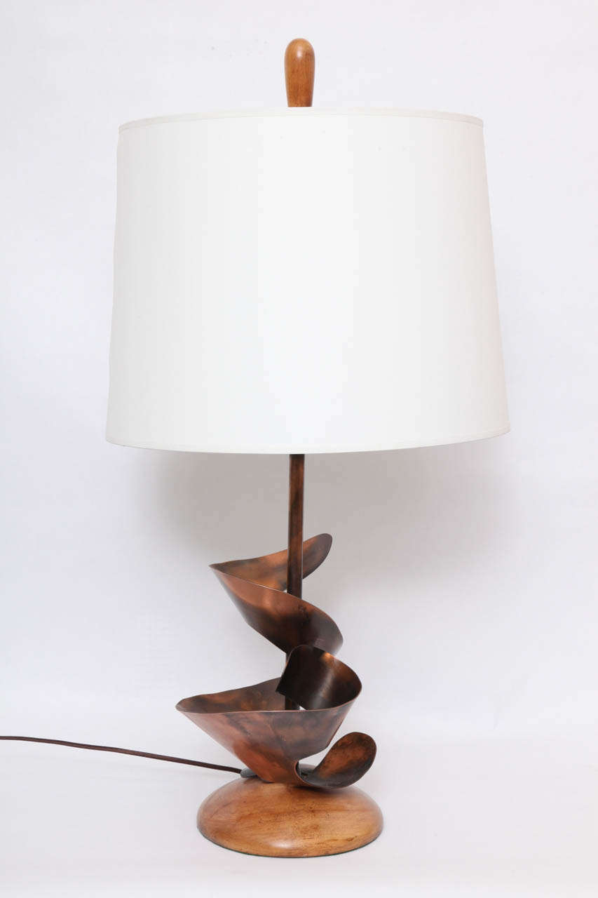 A pair of 1950s sculptural patinated copper table lamps by Heifetz.
