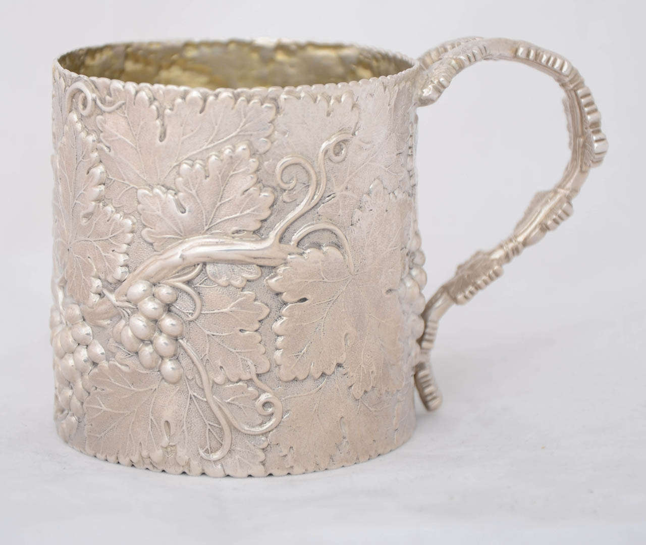 A beautiful English antique sterling silver William IV Mug, hallmarked Birmingham 1833 and made by Joseph Wilmore. This mug is heavier than is usual for this design at 212gms. It is 7.8cms high and is a lovely example of vine design.