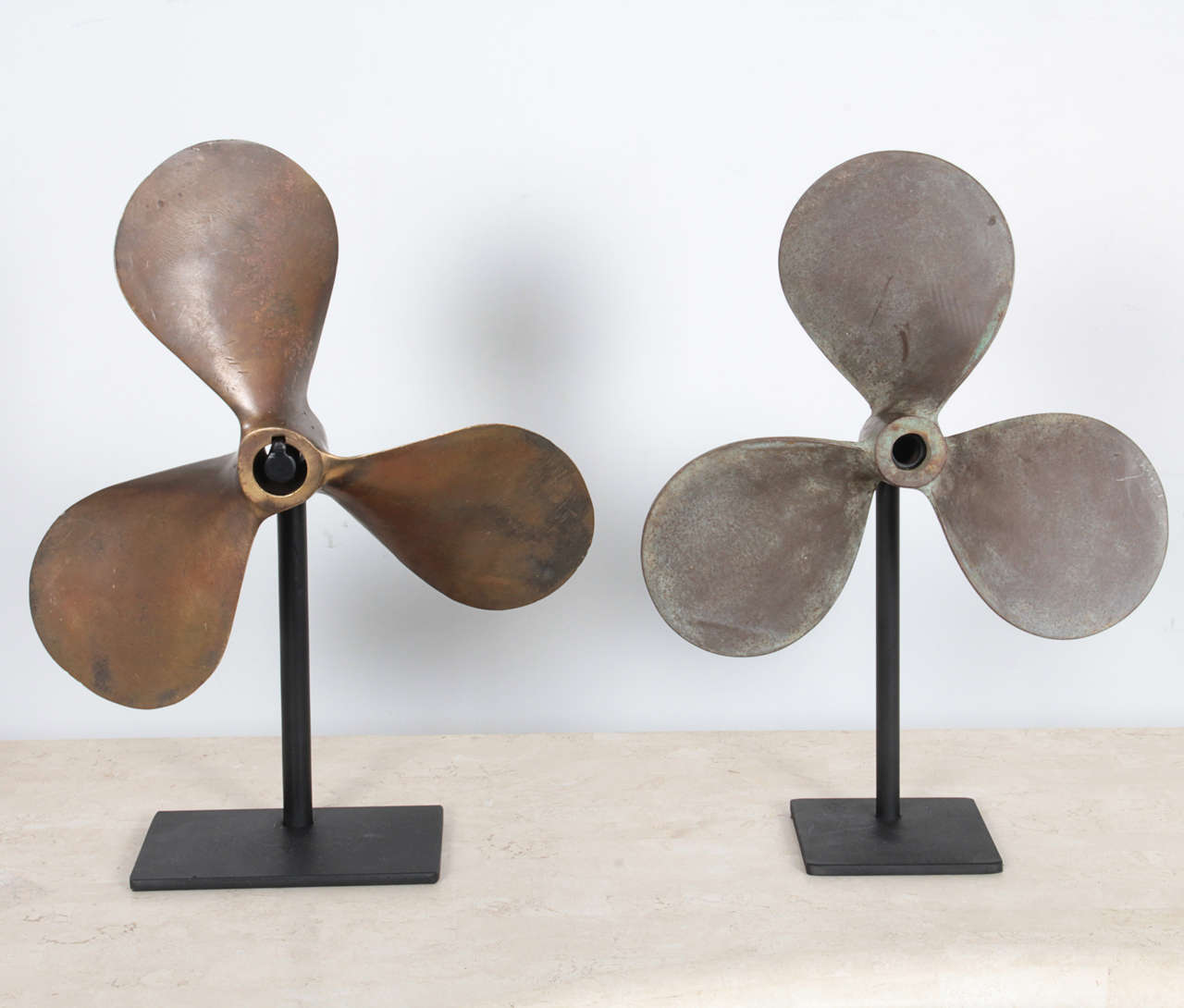 Pair of Vintage Patinated Brass Boat Propellers on Stands. Price is per item.