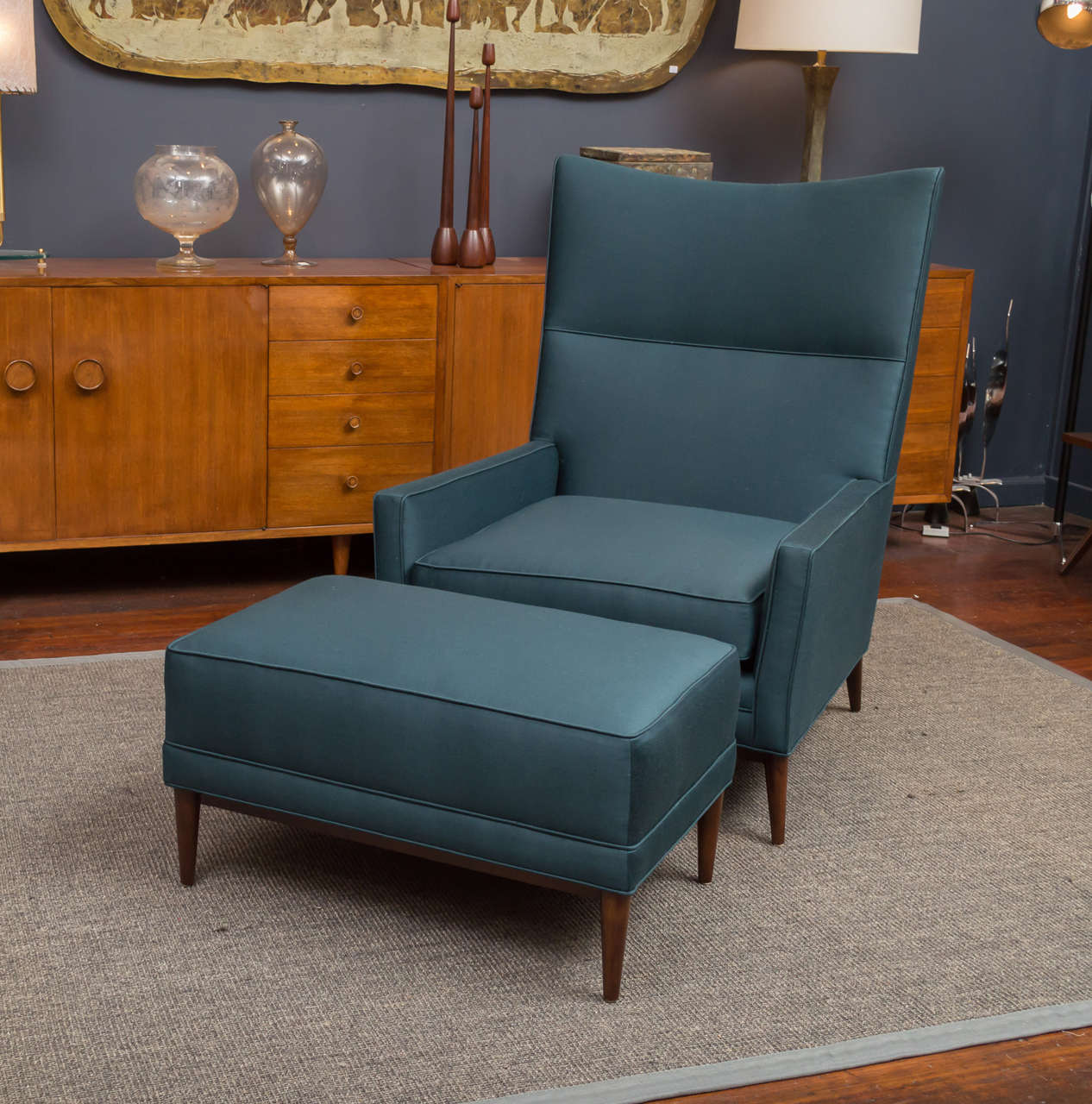 Paul McCobb design large high back lounge chair and ottoman for Winchendon.
New deep teal green satin upholstery on refinished legs.
Matching ottoman is 29 1/4