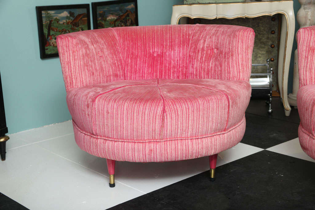 Peppermint candy velvet circular chairs. Pink painted tapered wood legs with brass feet.