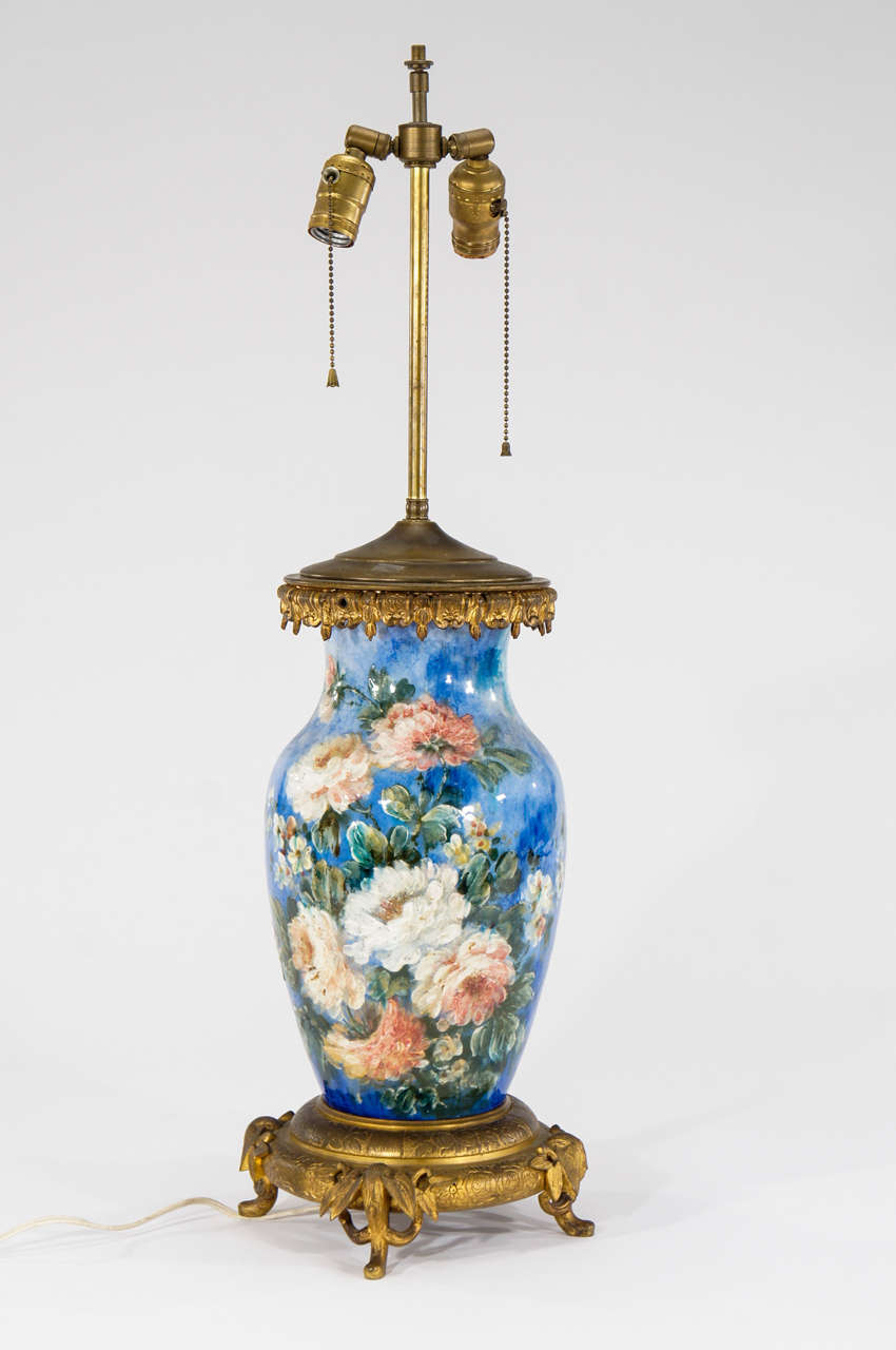 This fabulous lamp is a beautiful example of the 19th c. French Barbotine porcelain decoration, completely hand painted with thick impasto enamels in soft naturalistic colors with a botanical motif. The palette and technique are evocative of a fine