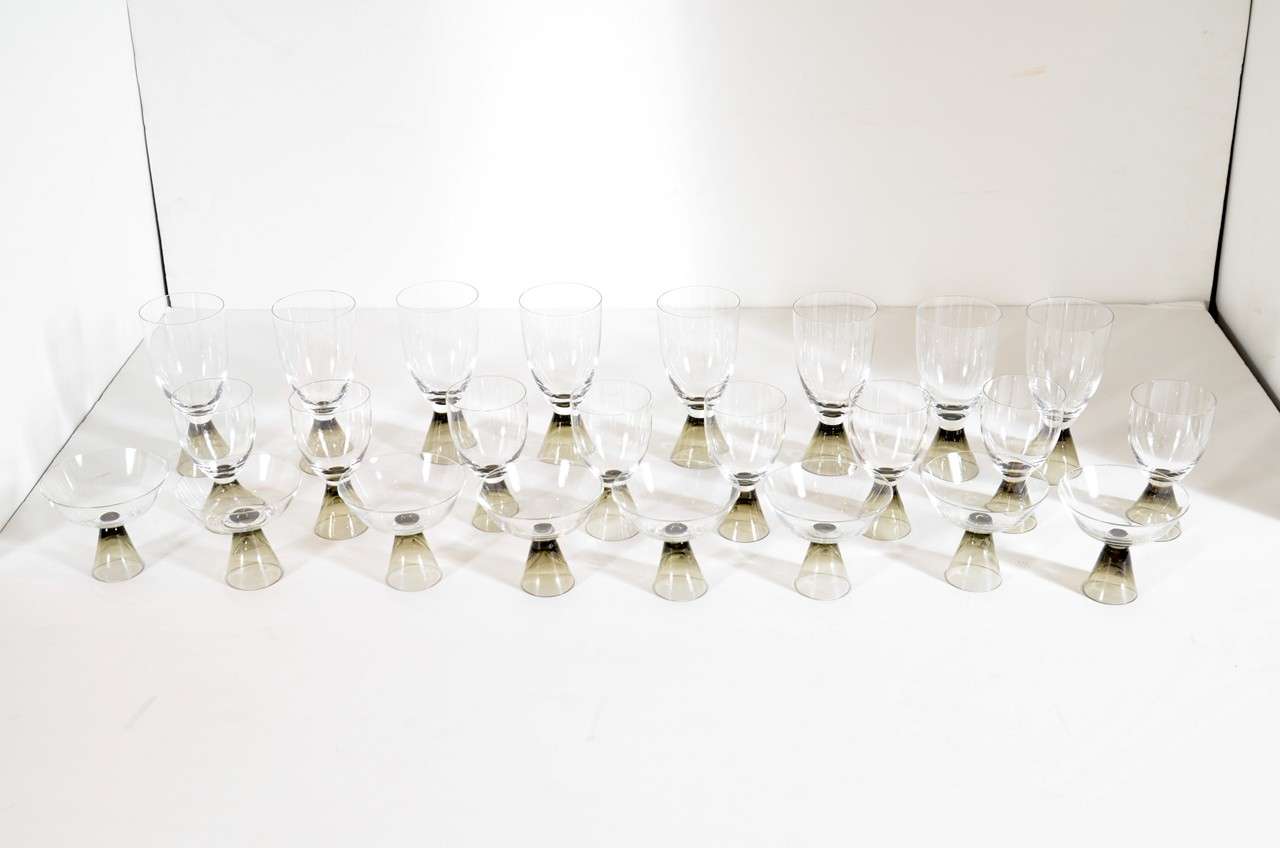 This stunning set of Rosenthal crystal features a conical smoked crystal base. Set of 8 water,Eight wine and eight Champagne/Martini glasses. There are all signed Rosenthal as well. 