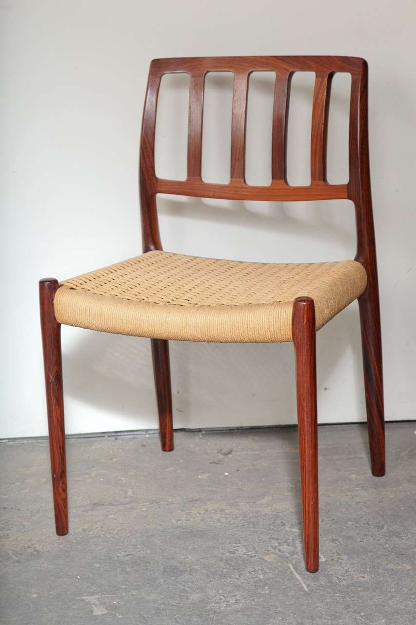 Niels Moller No. 83 Rosewood Danish Modern Dining Chairs. Scandinavian Furniture.

Set of 6 Rosewood Niels Moller No. 83 Dining Chairs with papercord seats. Features an ergonomically designed slightly curved backrest and solid rosewood frame. 