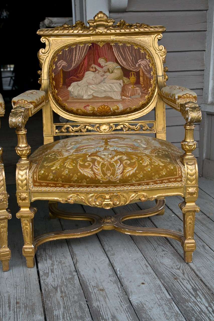 2  large fauteuils and an open armed canapé  comprise this set, with the original tapestry upholstery in Louis  xvi classical style.
The fauteuils are of  large size and the dimensions below are for the canapé.
The canapé has  an incurving seat