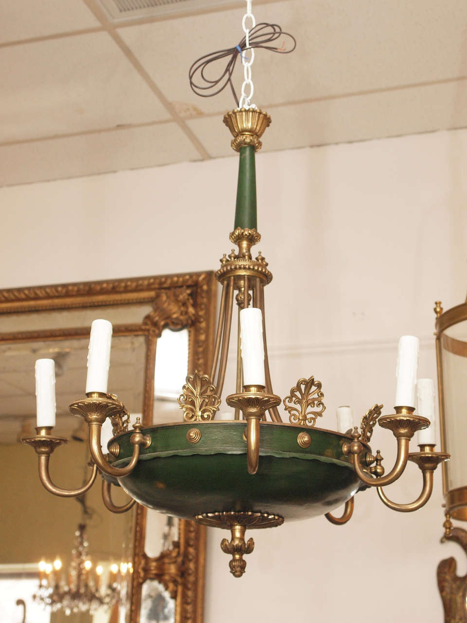 Early 20th c. French, Empire, style chandelier.  The tole painted dish is mounted with bronze reticulated anthemia and eight bronze candle branches which support leaf-molded drip pans and candle cups holding beeswax candle sleeves. A leaf-molded