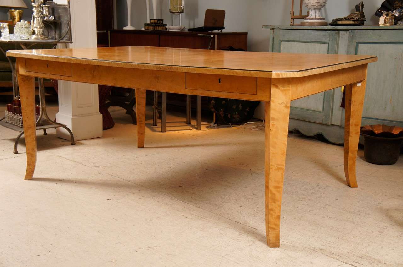 Biedermeier-style satinwood birch library or dining room  table with four drawers.  Mitered corners.