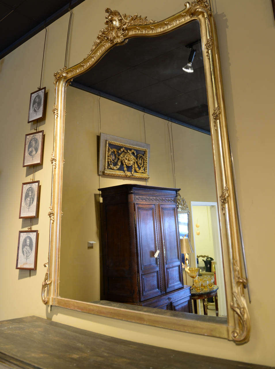 Quite a large mirror that makes an elegant statement.  The delicate fluid lines, in Louis XVth style, along with beautiful roses and leaves adorn the frame.