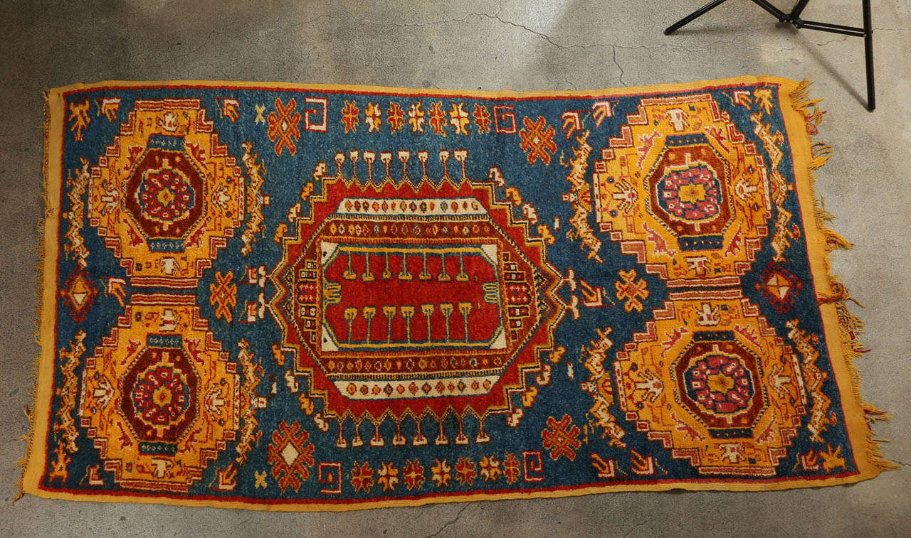 Vintage Moroccan Tribal African Rug. 
Stunning indigo blue colors with oranges, abstract tribal design, handwoven by Moroccan Berber women.
North Africa, Morocco, circa 1960's.