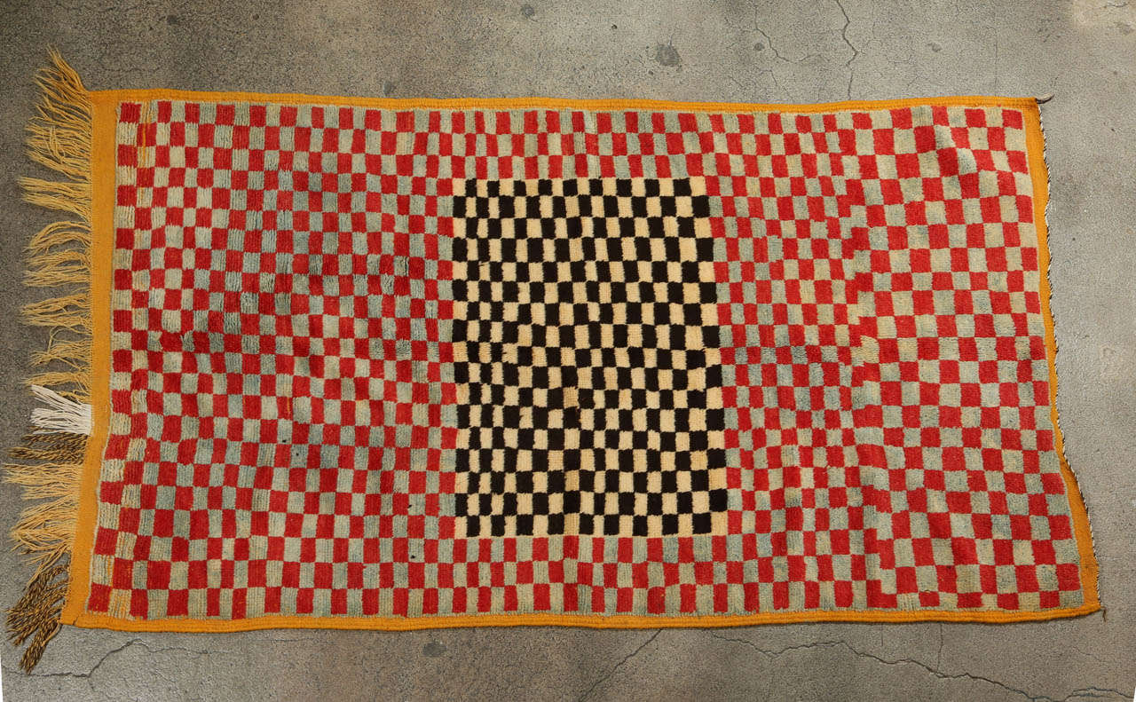 Handwoven vintage Moroccan Rug with checker designs in orange, rust, black and light blue colors. Very unusual modernist rug.