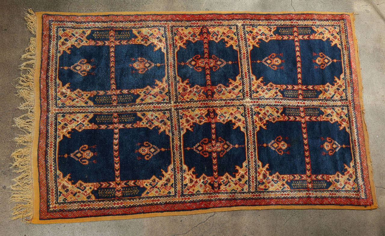 Fabous authentic 1960s vintage Moroccan tribal African rug.Handwoven by Berber women in Morocco using organic wo and vegetable dyes. Very nice earth tone cors with dark royal blue.Some issues on the edges, some tiny hes on the edges, see last