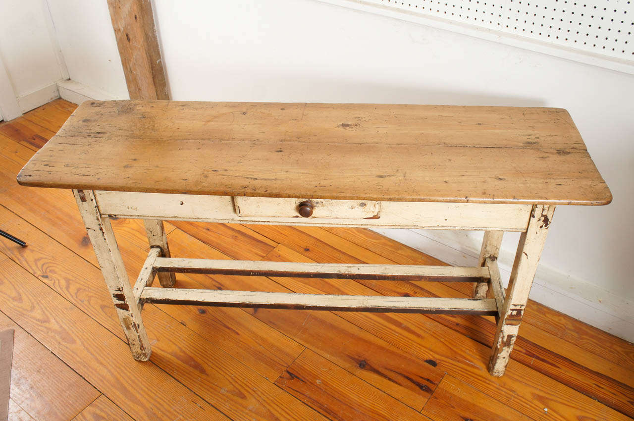 With original paint, we love Irish pieces. They have a style of their own. The stretcher base under the table is very nice and the color is stunning. This piece would work anywhere in a home. It is not a massive piece and if you like worn country