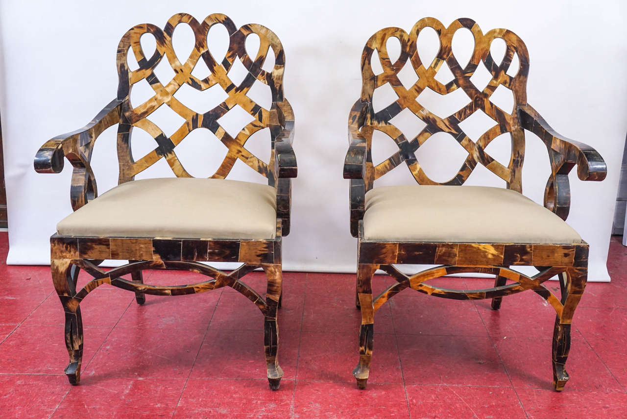 Pair of Francis Elkins style armchairs covered with tessellated horn upholstered in beige fabric.
Dimensions: Arm height 26.5