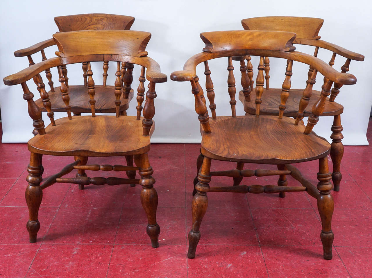 These chairs have boldly turned legs and spindles, hand-carved seats and back panels with an elegant sweep combined with solidly built oak construction including double stretchers. All chair dimensions vary slightly due to hand craftsmanship, circa
